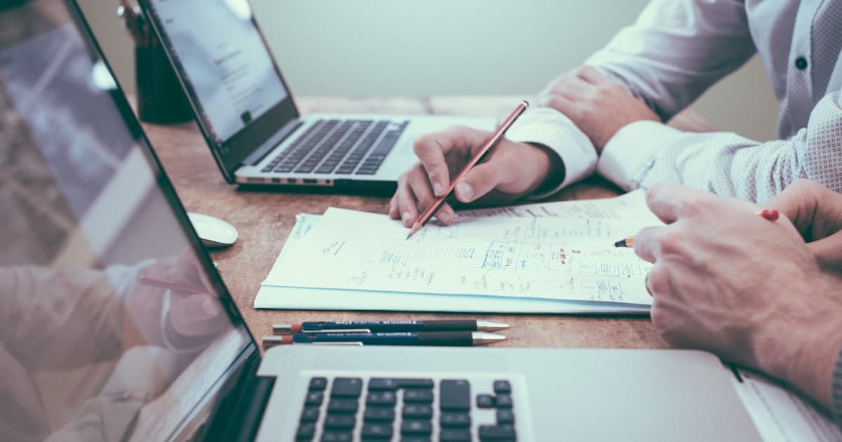 Business professionals reviewing company registration documents in Ghana